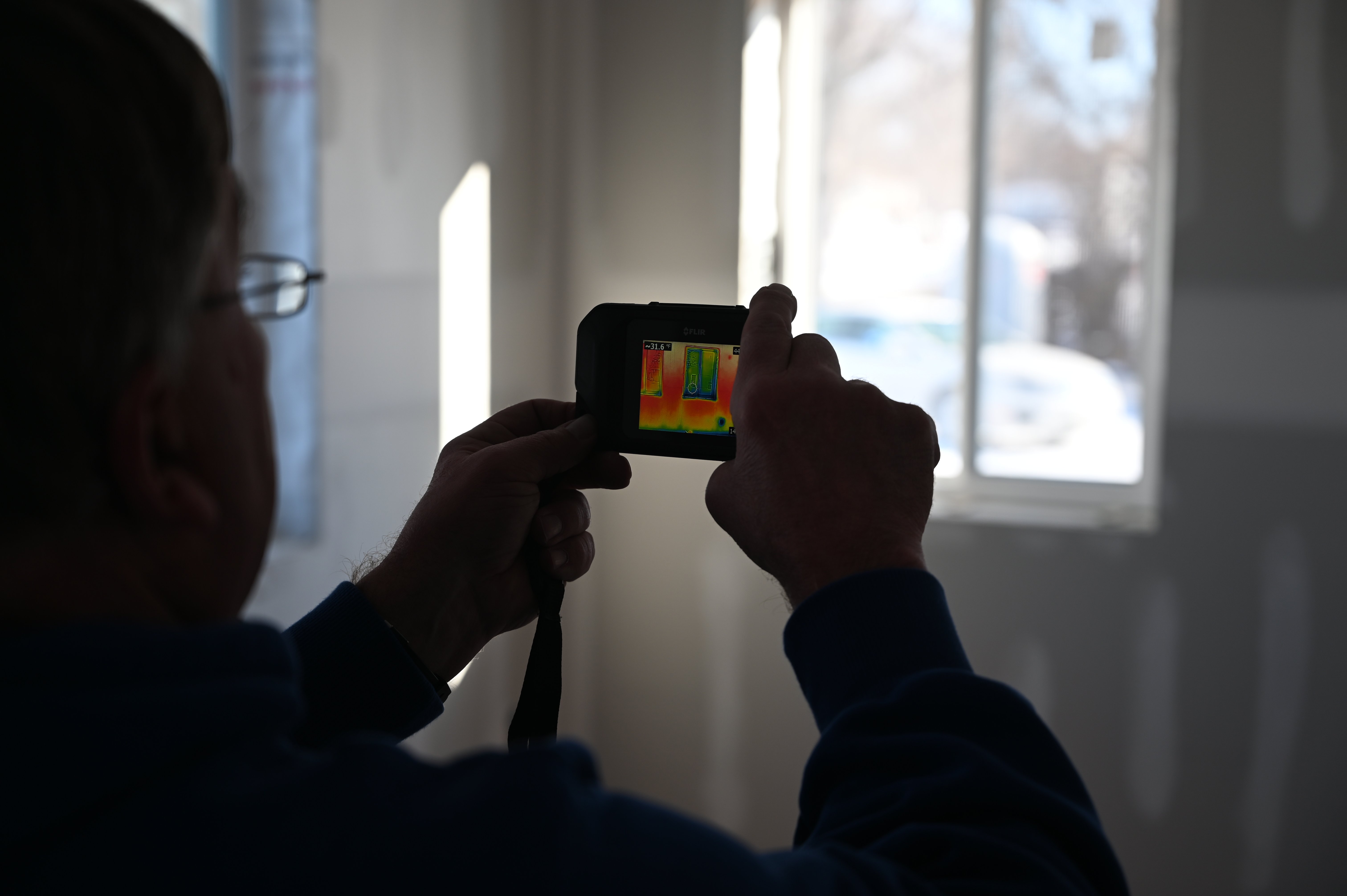 Thermal Camera highlighting the difference in temperature between a window and its surrounding wall. 