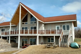 lake house with canoe