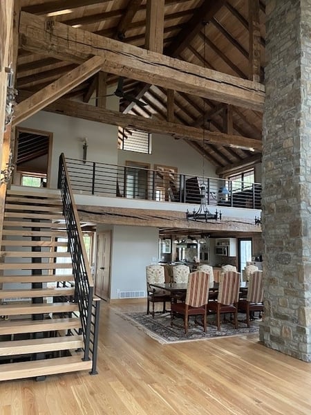 SIP Timberframe Lake cabin Staircase and dining room