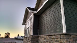 A house with visible lines of frost, a sign of poor heat retention
