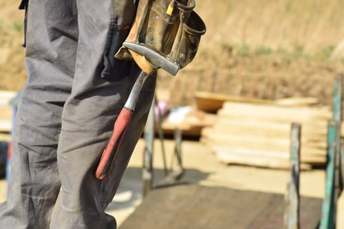 man wearing a tool belt